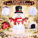G128 5FT inflatable Christmas snowman with top hat, red scarf and Let It Snow banner lit up in a yard