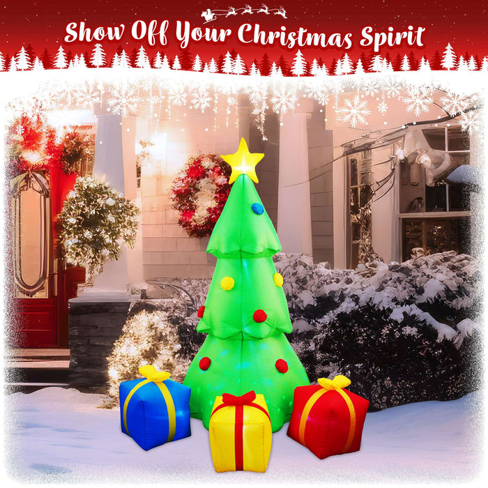 G128 7FT inflatable Christmas tree with three gift boxes and built-in LED lights lit up in a yard