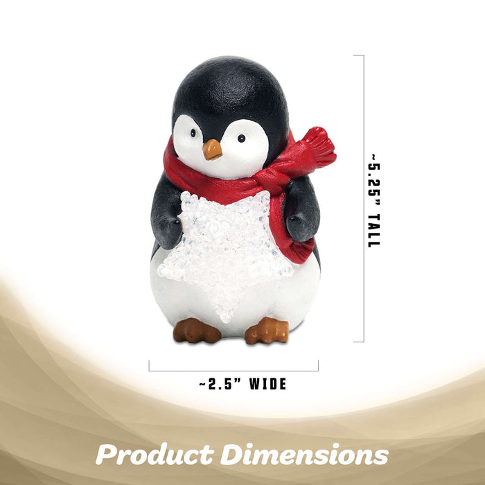 G128 resin penguin statue holding a light-up LED star, 5 inch tabletop holiday figurine
