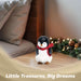 G128 resin penguin statue holding a light-up LED star, 5 inch tabletop holiday figurine