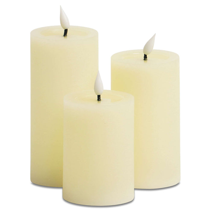 G128 set of three white flameless LED pillar candles in 6, 5, and 4 inch heights