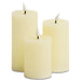 G128 set of three white flameless LED pillar candles in 6, 5, and 4 inch heights