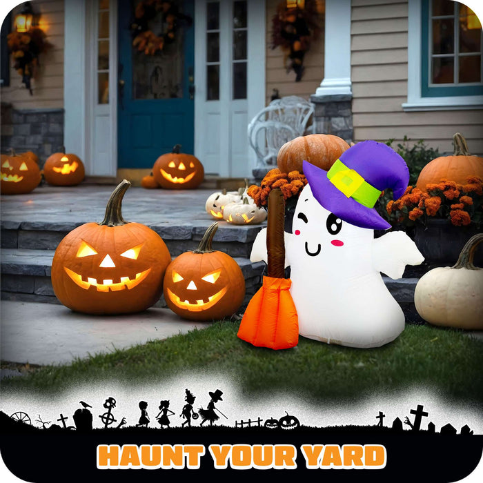 G128 3.5FT inflatable Halloween ghost in a witch hat holding a broom, glowing on a front porch
