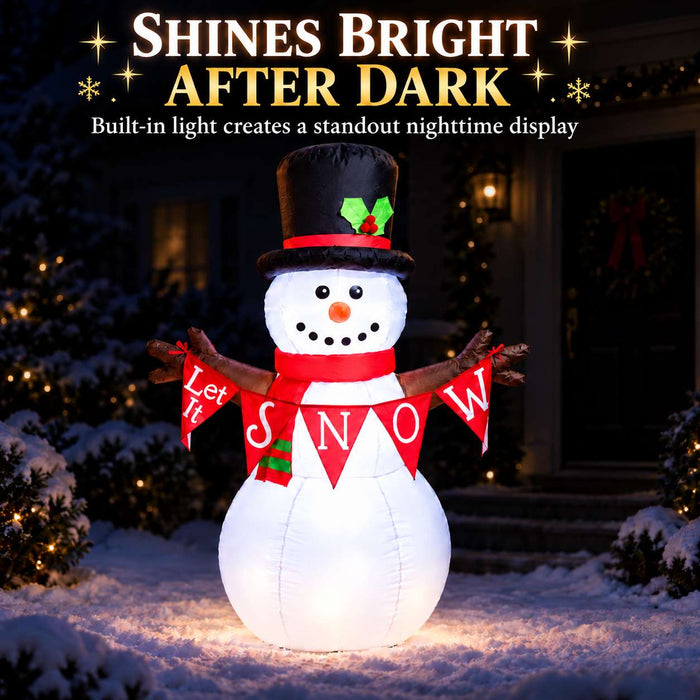 G128 5FT inflatable Christmas snowman with top hat, red scarf and Let It Snow banner lit up in a yard