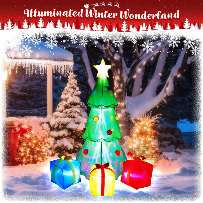 G128 7FT inflatable Christmas tree with three gift boxes and built-in LED lights lit up in a yard